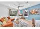 Comfortable living room with a cozy sofa, decorative rug, natural light, and a modern ceiling fan at 2801 N 10Th St, Phoenix, AZ 85006