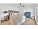 Bright main bedroom showcases a wooden headboard, bedside tables, dressers, and ensuite bathroom at 2801 N 10Th St, Phoenix, AZ 85006
