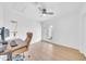 Bright office space with light wood floors, a ceiling fan, and a door to a private patio at 2801 N 10Th St, Phoenix, AZ 85006