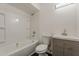 A full bathroom featuring a shower-tub combo, single sink vanity, and tile flooring at 3017 N 46Th Dr, Phoenix, AZ 85031