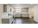 Modern kitchen boasts stainless steel appliances, granite countertops, and a stylish backsplash at 3017 N 46Th Dr, Phoenix, AZ 85031