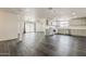 Open concept living area featuring stylish flooring, plenty of natural light, and a modern color palette at 3017 N 46Th Dr, Phoenix, AZ 85031