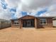 New construction home with a large, blank canvas backyard and covered patio at 37114 W La Paz St, Maricopa, AZ 85138