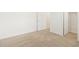 A bedroom shows neutral carpet and base molding with access to a walk-in closet at 37114 W La Paz St, Maricopa, AZ 85138