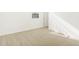 Bright bedroom featuring neutral carpet, white walls, and natural light at 37114 W La Paz St, Maricopa, AZ 85138