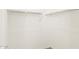 Walk-in closet with white walls, shelving, and hanging rods at 37114 W La Paz St, Maricopa, AZ 85138
