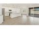 Open-concept kitchen featuring stainless appliances, large island, sleek cabinetry, and plenty of natural light at 37114 W La Paz St, Maricopa, AZ 85138