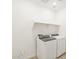 The laundry room has a washer and dryer with a shelf above, plus tile floors and ventilation at 37114 W La Paz St, Maricopa, AZ 85138
