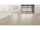 Open living space featuring tile floors and sliding glass doors to the backyard and patio at 37114 W La Paz St, Maricopa, AZ 85138