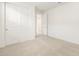 Spacious bedroom with soft carpet, a closet and a neutral walls, creating a minimalist and comfortable design at 37371 W San Sisto Ave, Maricopa, AZ 85138