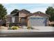 Charming single-story home featuring desert landscaping, a two-car garage, and a covered front entry at 37371 W San Sisto Ave, Maricopa, AZ 85138
