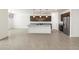 Stylish kitchen featuring dark cabinets, granite countertops, stainless steel appliances, and a central island at 37371 W San Sisto Ave, Maricopa, AZ 85138