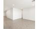 Bright, open living room with recessed lighting and neutral tile flooring, perfect for entertaining at 37371 W San Sisto Ave, Maricopa, AZ 85138