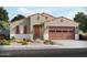 Charming single-story home boasts a desert-landscaped yard and a two-car garage at 37414 W San Sisto Ave, Maricopa, AZ 85138