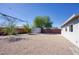 The spacious backyard features a rock ground cover and a storage shed at 3841 N 21St Ave, Phoenix, AZ 85015