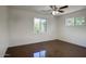 Bright and airy bedroom with multiple windows and modern ceiling fan at 3841 N 21St Ave, Phoenix, AZ 85015