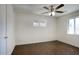 This cozy bedroom features a ceiling fan and natural light from two windows at 3841 N 21St Ave, Phoenix, AZ 85015