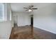 Spacious room with a ceiling fan, new windows, and access to other parts of the house at 3841 N 21St Ave, Phoenix, AZ 85015