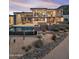 Resort-style backyard featuring a modern pool, stone accents, outdoor bar, and desert landscaping at 39602 N Charles Blair Macdonald Rd, Scottsdale, AZ 85262
