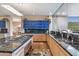 Elegant kitchen featuring granite countertops, modern appliances, and ample cabinet space at 39602 N Charles Blair Macdonald Rd, Scottsdale, AZ 85262