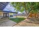 Landscaped backyard featuring a patio, artificial grass, and a playset, perfect for outdoor enjoyment at 4162 W Sierra St, Phoenix, AZ 85029