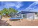 Spacious backyard featuring a trampoline and desert landscaping, ideal for outdoor activities at 4162 W Sierra St, Phoenix, AZ 85029