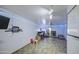 Versatile basement space with desk area, game area and neutral painted walls with ample lighting at 4162 W Sierra St, Phoenix, AZ 85029