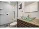 Modern bathroom with a glass bowl sink, granite countertop, and a glass-enclosed shower for a spa-like experience at 4162 W Sierra St, Phoenix, AZ 85029