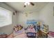 Adorable bedroom featuring a princess-themed bed, playful stuffed animals, and a cozy reading nook at 4162 W Sierra St, Phoenix, AZ 85029