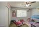 Cheerful bedroom with playful decor, closet space, and a window for natural light at 4162 W Sierra St, Phoenix, AZ 85029