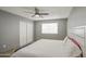 Inviting bedroom features a window, a ceiling fan, and a large closet at 4162 W Sierra St, Phoenix, AZ 85029