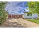 A view of the decorative metal fence and gravel driveway of this delightful home at 4162 W Sierra St, Phoenix, AZ 85029