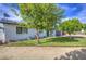 Charming single-story home featuring manicured landscaping, solar panels, and a spacious driveway at 4162 W Sierra St, Phoenix, AZ 85029