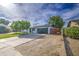 Charming single-story home featuring manicured landscaping, solar panels, and a spacious driveway at 4162 W Sierra St, Phoenix, AZ 85029