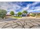 Charming single-story home featuring manicured landscaping, solar panels, and a spacious driveway at 4162 W Sierra St, Phoenix, AZ 85029