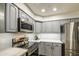 A well-lit kitchen with stainless steel appliances and light gray cabinetry at 4162 W Sierra St, Phoenix, AZ 85029