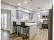 Kitchen features stainless appliances, light gray cabinetry, breakfast bar, and french doors at 4162 W Sierra St, Phoenix, AZ 85029