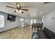 Expansive living area features tile floors, ceiling fan, and dining table at 4162 W Sierra St, Phoenix, AZ 85029