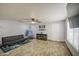 Spacious living room with ceiling fan and wood-look tile at 4162 W Sierra St, Phoenix, AZ 85029