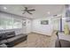 The cozy living room features wood look flooring and access to other areas of the home at 4162 W Sierra St, Phoenix, AZ 85029