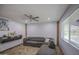 An ample living room featuring wood look flooring and a ceiling fan for comfort at 4162 W Sierra St, Phoenix, AZ 85029