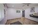 The cozy living room features wood look flooring and access to other areas of the home at 4162 W Sierra St, Phoenix, AZ 85029