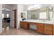 Spacious primary bath with double sinks, lots of light, and entry to bedroom at 43228 W Knauss Dr, Maricopa, AZ 85138