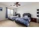 Bedroom with two twin beds, built in nightstands, and plenty of light at 43228 W Knauss Dr, Maricopa, AZ 85138