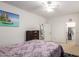 Bright bedroom features dresser and walk-in closet at 43228 W Knauss Dr, Maricopa, AZ 85138