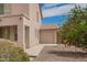 View of house showing entrance and detached garage at 43228 W Knauss Dr, Maricopa, AZ 85138