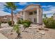 Beautiful two-story home features a well-maintained yard, desert landscaping, and cozy porch seating at 43228 W Knauss Dr, Maricopa, AZ 85138