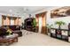 Inviting living room with rich brown accents, comfortable seating, and abundant natural light at 43228 W Knauss Dr, Maricopa, AZ 85138