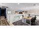 Open loft area with workstation, neutral walls and carpeted floors has views into the living area below at 43228 W Knauss Dr, Maricopa, AZ 85138