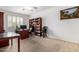 Spacious office space features a large desk and shelving units at 43228 W Knauss Dr, Maricopa, AZ 85138